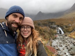 Elizabeth and Kevin pose on the Isle of Skye in Scotland