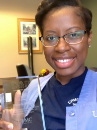 Mpande smiles with her award.